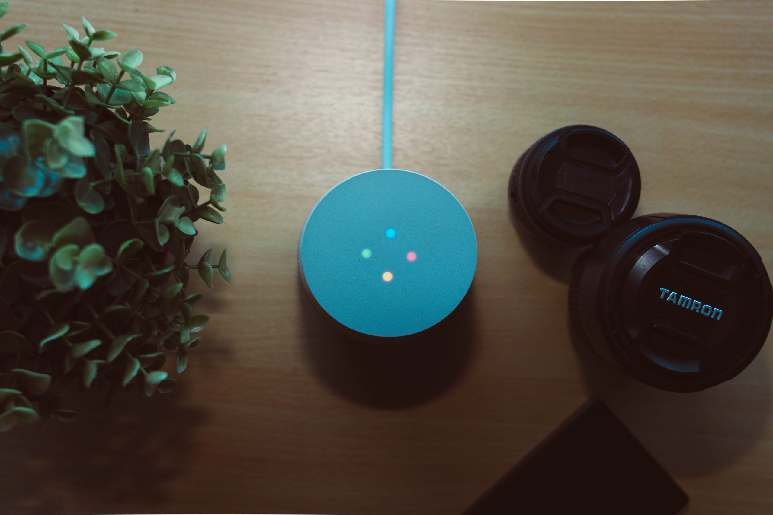 Photo of a Google Home and lenses on a table