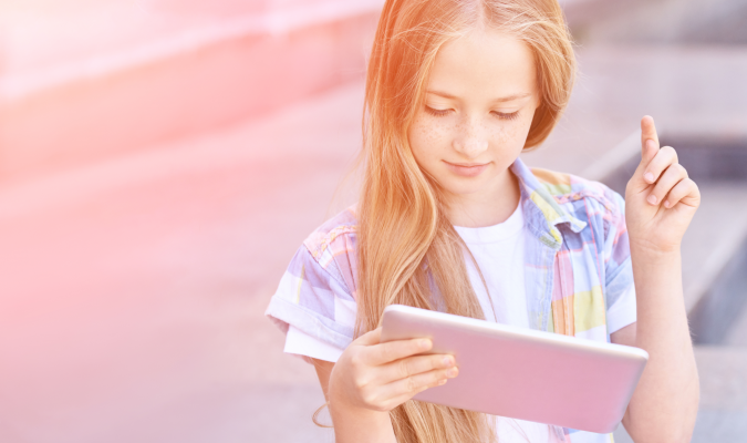 Photo of a girl using a tablet