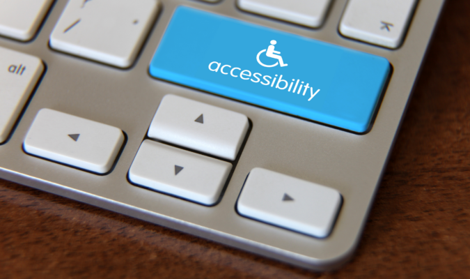 Photograph of a laptop with a key labeled "Accessibility" on its keyboard